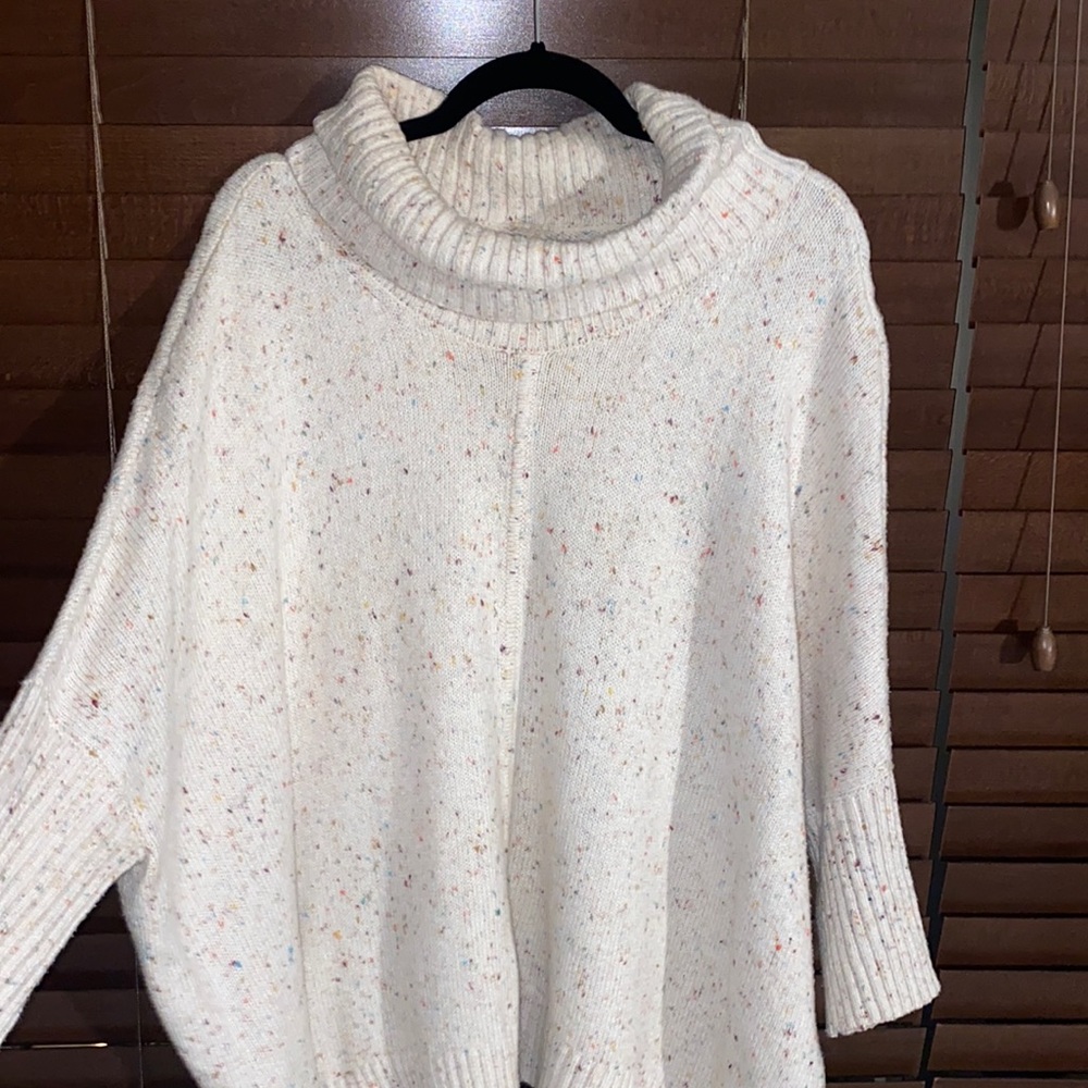 Multi color spec creme turtleneck sweater